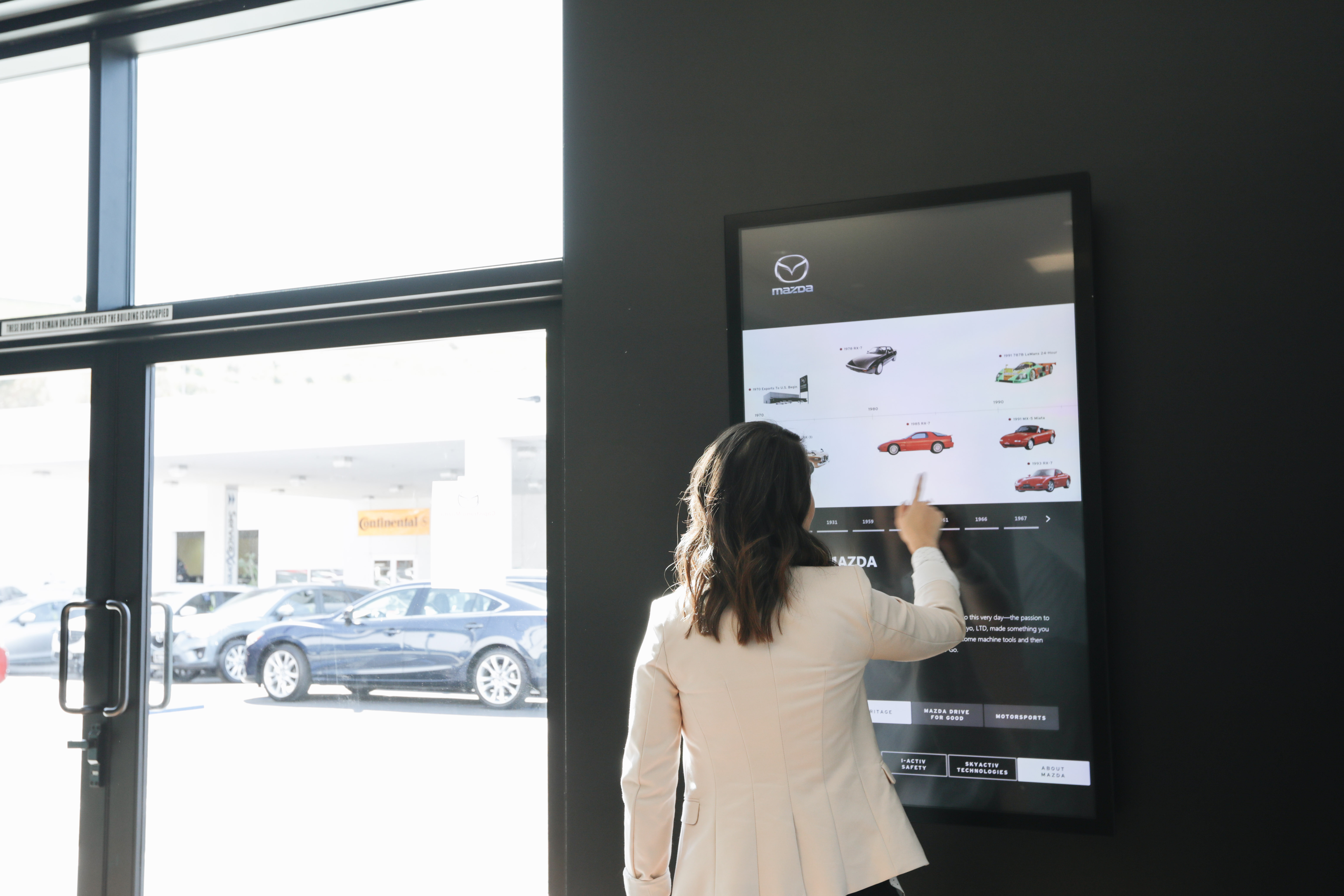 Mazda interactive touchscreen installed in a dealership showroom